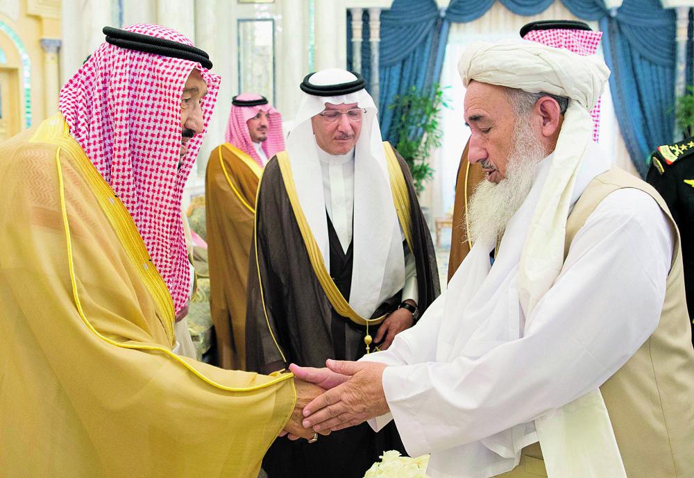 خادم الحرمين لوفد مؤتمر السلام: متفائلون بطي صفحة الماضي