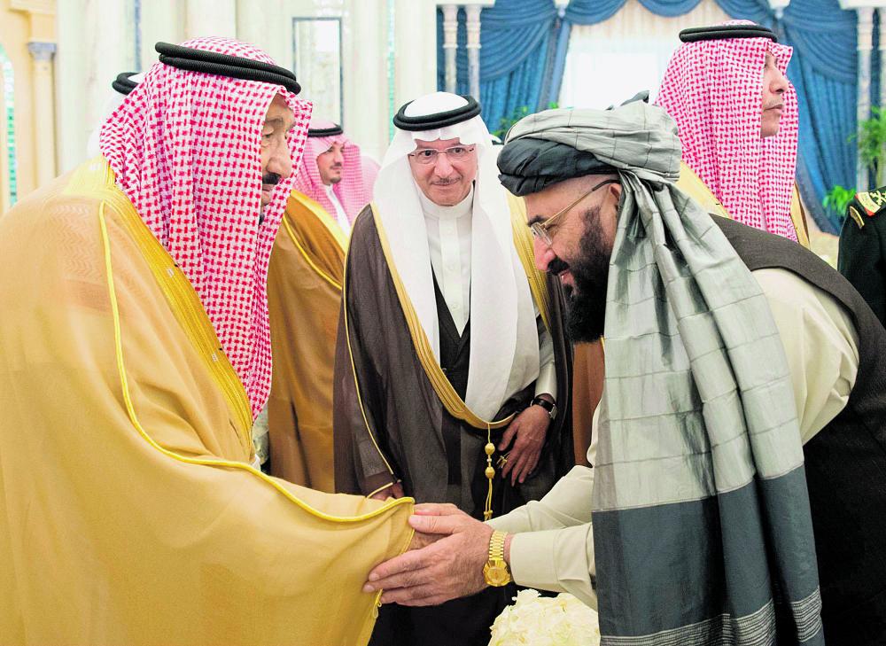 خادم الحرمين لوفد مؤتمر السلام: متفائلون بطي صفحة الماضي