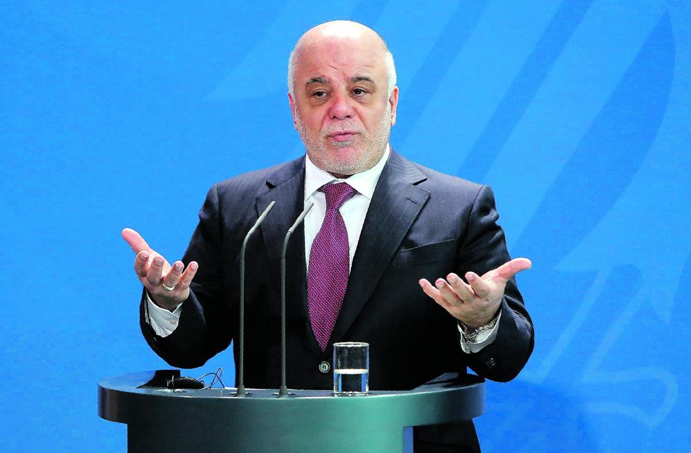 العبادي يتراجع عن التزام بلاده بالعقوبات الأمريكية