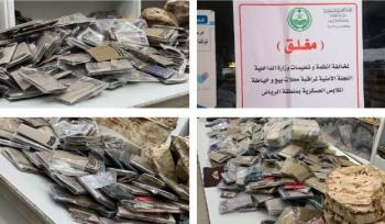 ضبط 100 بدلة عسكرية بمحل مخالف بالرياض