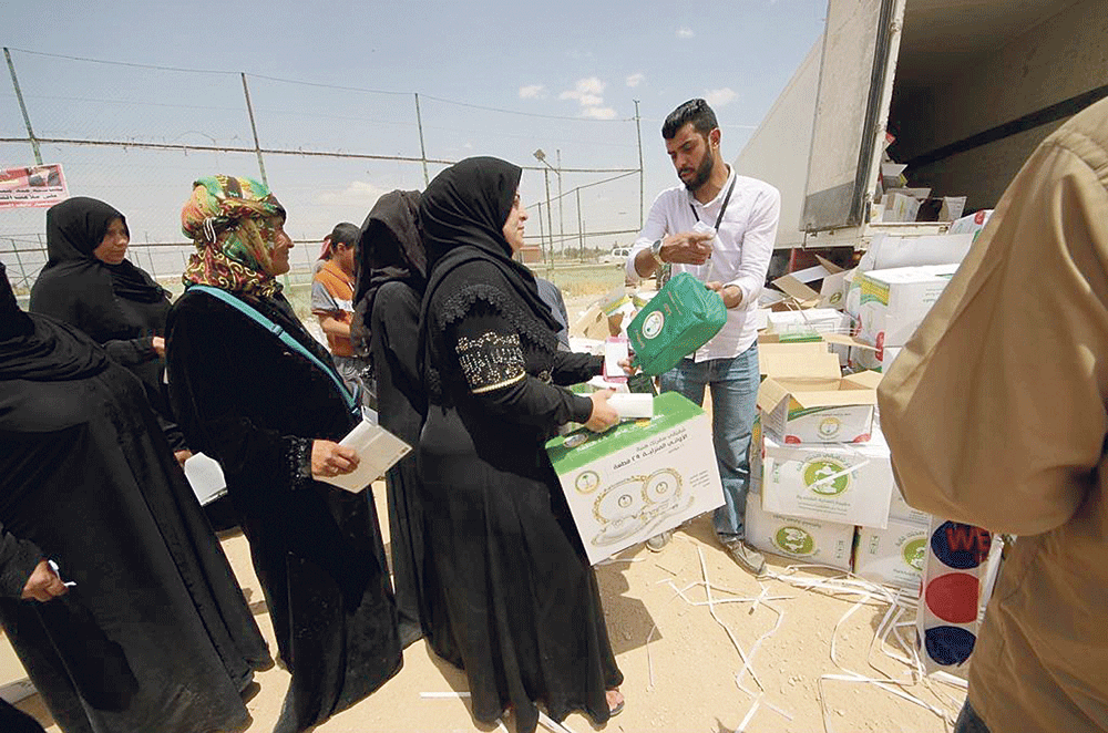 توزيع المساعدات السعودية على لاجئي سوريا (واس)