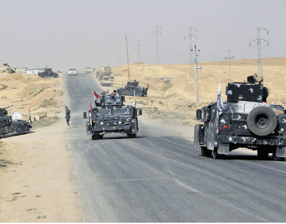 القوات العراقية تحكم سيطرتها على المناطق الحدودية مع تركيا (أ ف ب)